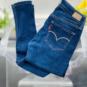Levi’s, dark blue , stretch , pencil leg , ankle length jeans.